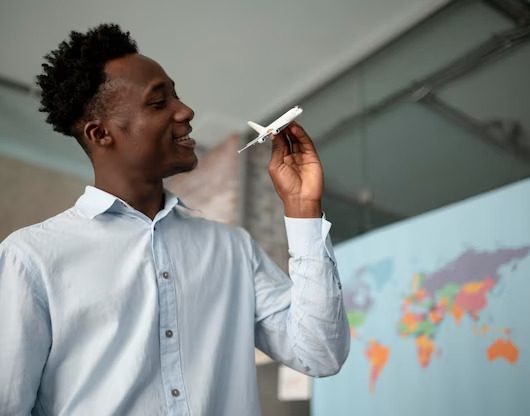 medium-shot-man-holding-small-plane_23-2149080857